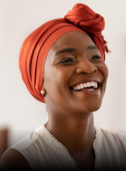 Smiling patient showcasing natural-looking veneers