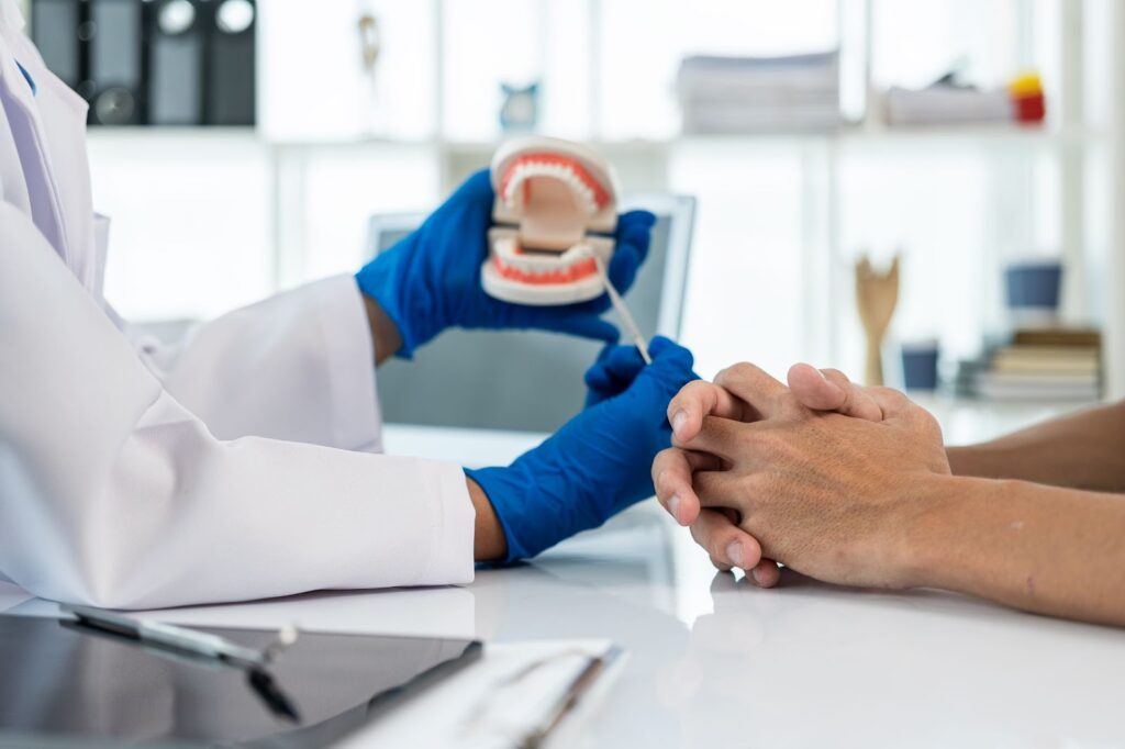 Dentist and patient discussion about planned dental treatment in dental clinic office